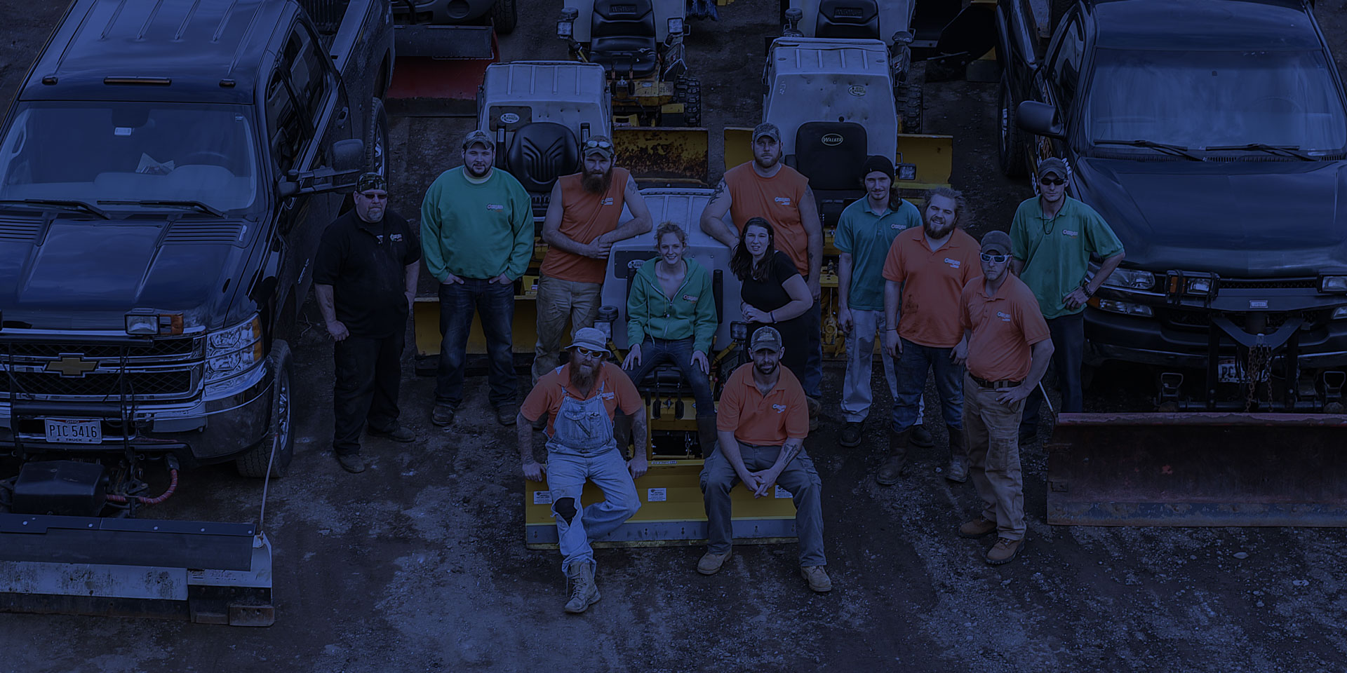 The O'Bryan crew standing with the truck fleet at the Stow yard
